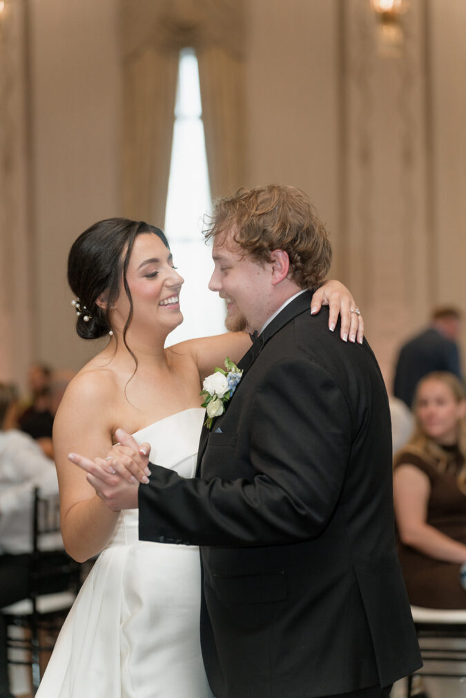 Newlywed couple takes their first dance at the Tulsa Club Hotel.