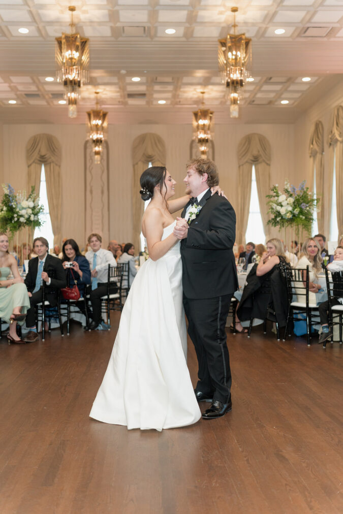 Newlywed couple takes their first dance at the Tulsa Club Hotel.
