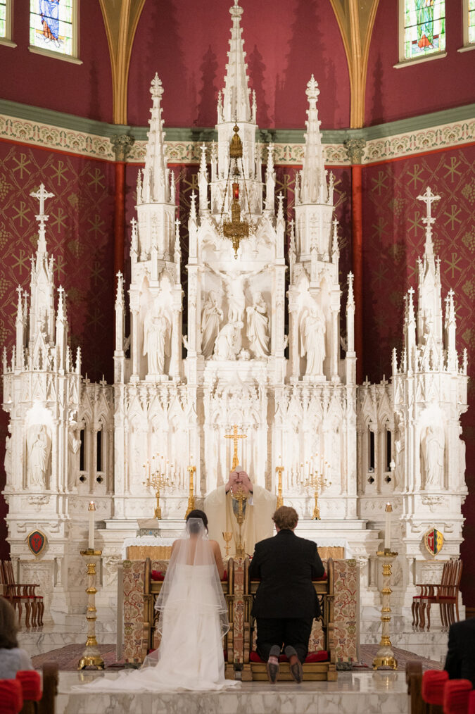 Refined wedding ceremony captured at the Holy Family Cathedral in Tulsa, Oklahoma.