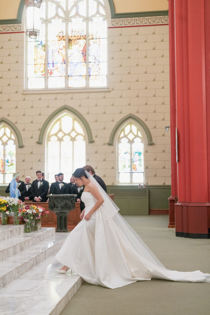 Refined wedding ceremony captured at the Holy Family Cathedral in Tulsa, Oklahoma.